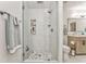 Modern bathroom featuring a glass shower with marble tile and a built-in shelf at 825 Clarion Way, Lawrenceville, GA 30044