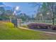 Enjoy a match on this outdoor tennis court with lighting for evening play in a beautiful landscaped surrounding at 825 Clarion Way, Lawrenceville, GA 30044