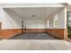 Open-air garage with brick and siding at 2694 Hickory Valley Dr, Snellville, GA 30078