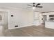 Inviting living room with an open floor plan and modern kitchen with stainless steel appliances at 2694 Hickory Valley Dr, Snellville, GA 30078