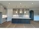 Bright kitchen with modern island, custom cabinets, and elegant pendant lighting at 4209 Legacy Ln # 31, Acworth, GA 30101