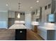 Kitchen with a large center island, custom cabinets and sleek modern fixtures. Ready to complete! at 4209 Legacy Ln # 31, Acworth, GA 30101