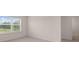 Bedroom with gray carpet and a view of the outside at 1119 Blue Juniper Circle, Loganville, GA 30052
