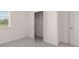 The bedroom has neutral walls and carpet flooring and features a closet at 1119 Blue Juniper Circle, Loganville, GA 30052