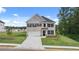 Beautiful two-story home with a well-manicured lawn, attached garage and classic architectural features at 1119 Blue Juniper Circle, Loganville, GA 30052