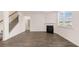 The living room features vinyl flooring, a fireplace, and stairs that lead to the second floor at 1119 Blue Juniper Circle, Loganville, GA 30052