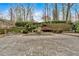 The backyard is paved in brick with a gunite pool, waterfall feature, and manicured landscaping at 115 Mount Paran Rdg, Atlanta, GA 30327