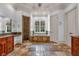 Elegant bathroom featuring stone floors, a soaking tub, and a separate shower at 115 Mount Paran Rdg, Atlanta, GA 30327