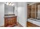 Bathroom featuring a decorative vanity, bronze shower and granite countertops at 115 Mount Paran Rdg, Atlanta, GA 30327