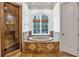 Bathroom featuring soaking tub, shower with travertine surround, and natural light at 115 Mount Paran Rdg, Atlanta, GA 30327