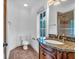 Well-lit bathroom featuring a granite vanity, and a tiled shower with sliding glass doors at 115 Mount Paran Rdg, Atlanta, GA 30327