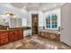 Bathroom featuring soaking tub, large vanity, shower, and natural light at 115 Mount Paran Rdg, Atlanta, GA 30327