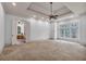 Large bedroom with carpet, tray ceiling, ceiling fan and connecting bath at 115 Mount Paran Rdg, Atlanta, GA 30327