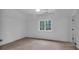 Bright bedroom features large window for ample natural light and neutral carpet at 115 Mount Paran Rdg, Atlanta, GA 30327