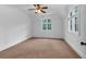 Bright bedroom with neutral carpeting, white walls, vaulted ceilings and large windows at 115 Mount Paran Rdg, Atlanta, GA 30327