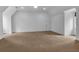 Spacious bonus room with neutral carpeting, white walls, and vaulted ceilings at 115 Mount Paran Rdg, Atlanta, GA 30327
