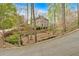 Home exterior featuring stone facade and mature landscaping at 115 Mount Paran Rdg, Atlanta, GA 30327
