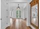 Grand foyer with hardwood floors, staircase, arched doorway and natural light at 115 Mount Paran Rdg, Atlanta, GA 30327