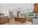 Gourmet kitchen with custom cabinets, center island, modern lighting, and stainless steel appliances at 115 Mount Paran Rdg, Atlanta, GA 30327