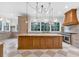 Gourmet kitchen featuring a center island, custom lighting, and top-of-the-line stainless steel appliances at 115 Mount Paran Rdg, Atlanta, GA 30327