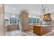 Gourmet kitchen with a center island, custom cabinets, modern lighting fixtures, and luxury finishes at 115 Mount Paran Rdg, Atlanta, GA 30327