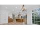 Open-concept kitchen with a large center island, custom cabinetry, and high-end stainless steel appliances at 115 Mount Paran Rdg, Atlanta, GA 30327