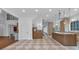 Open-concept kitchen with custom cabinets, stone countertops, beverage center and easy access to living areas at 115 Mount Paran Rdg, Atlanta, GA 30327