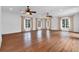 Large living room features hardwood floors, large windows and modern ceiling fans at 115 Mount Paran Rdg, Atlanta, GA 30327