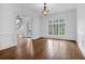 Bright living room features hardwood floors, wainscoting and views of the beautifully landscaped outdoor area at 115 Mount Paran Rdg, Atlanta, GA 30327