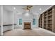 Living room with fireplace, built-in bookshelves, and a nearby desk area at 115 Mount Paran Rdg, Atlanta, GA 30327