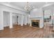 Bright living room with hardwood floors, fireplace, and doorways to adjoining spaces at 115 Mount Paran Rdg, Atlanta, GA 30327