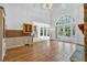 Bright living room with stone fireplace, high ceilings, hardwood floors, and large arched windows at 115 Mount Paran Rdg, Atlanta, GA 30327