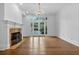 Living room featuring hardwood flooring, fireplace, and large doors to the outside at 115 Mount Paran Rdg, Atlanta, GA 30327