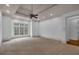 Spacious main bedroom boasts trey ceilings, fan, and large window for natural light at 115 Mount Paran Rdg, Atlanta, GA 30327