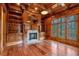 Wood-paneled office space with built-in bookshelves, fireplace, and large windows with views at 115 Mount Paran Rdg, Atlanta, GA 30327