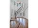 Elegant curved staircase with hardwood floors and lots of natural light at 115 Mount Paran Rdg, Atlanta, GA 30327