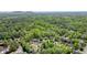 Beautiful aerial view of a wooded neighborhood with mature trees and well-maintained homes at 3130 Crestmont Nw Way, Kennesaw, GA 30152