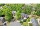 Aerial view of the home with mature trees and a circular driveway at 3130 Crestmont Nw Way, Kennesaw, GA 30152