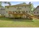 Large backyard with wood deck and stair access with a lawn and partial fence enclosure at 3130 Crestmont Nw Way, Kennesaw, GA 30152