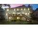 Backyard features multilevel wood deck, lawn, and privacy fencing, with an evening sky backdrop at 3130 Crestmont Nw Way, Kennesaw, GA 30152
