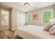 Charming bedroom with wood floors, large windows, and an ensuite bathroom at 3130 Crestmont Nw Way, Kennesaw, GA 30152