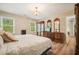 Comfortable bedroom with wood-look floors, and traditional furniture at 3130 Crestmont Nw Way, Kennesaw, GA 30152