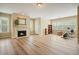 Bright bonus room with hardwood floors, fireplace, and home gym equipment at 3130 Crestmont Nw Way, Kennesaw, GA 30152
