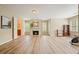Open bonus room with hardwood flooring, fireplace, and plenty of natural light at 3130 Crestmont Nw Way, Kennesaw, GA 30152