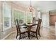 Bright breakfast nook with large windows and a chandelier, perfect for enjoying morning meals at 3130 Crestmont Nw Way, Kennesaw, GA 30152