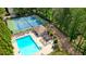 Community pool with bath house, tennis courts, pergola and lounging areas nearby at 3130 Crestmont Nw Way, Kennesaw, GA 30152