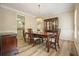 Formal dining room with hardwood floors, a chandelier, and a china cabinet at 3130 Crestmont Nw Way, Kennesaw, GA 30152
