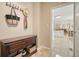 Inviting entryway with tiled floors, coat rack, and view of the bright, modern kitchen at 3130 Crestmont Nw Way, Kennesaw, GA 30152