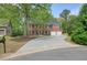 Charming two-story brick home featuring a large driveway and well-maintained landscaping at 3130 Crestmont Nw Way, Kennesaw, GA 30152