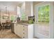 Bright kitchen featuring a breakfast nook, stainless steel appliances, granite countertops, and backyard access at 3130 Crestmont Nw Way, Kennesaw, GA 30152